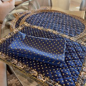 Set of 4 designer Valdrome linens with matching runners and round centers.